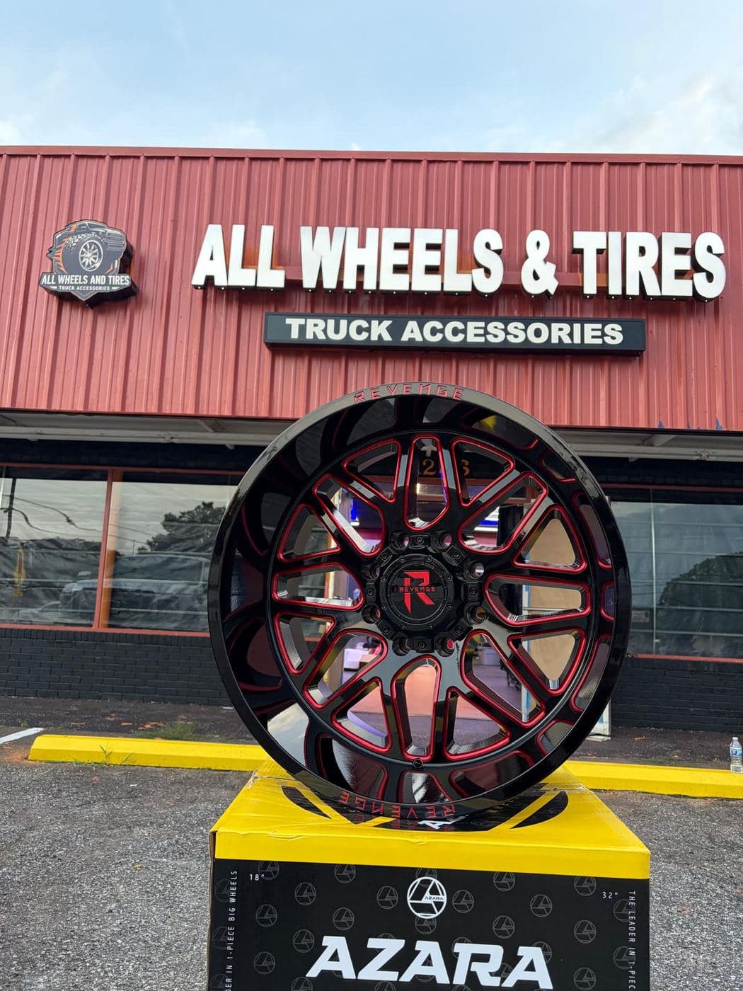 Off-road wheel on display in front of the shop